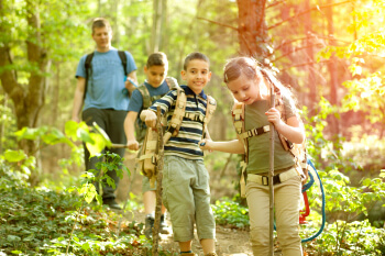 kids in green forest playing
